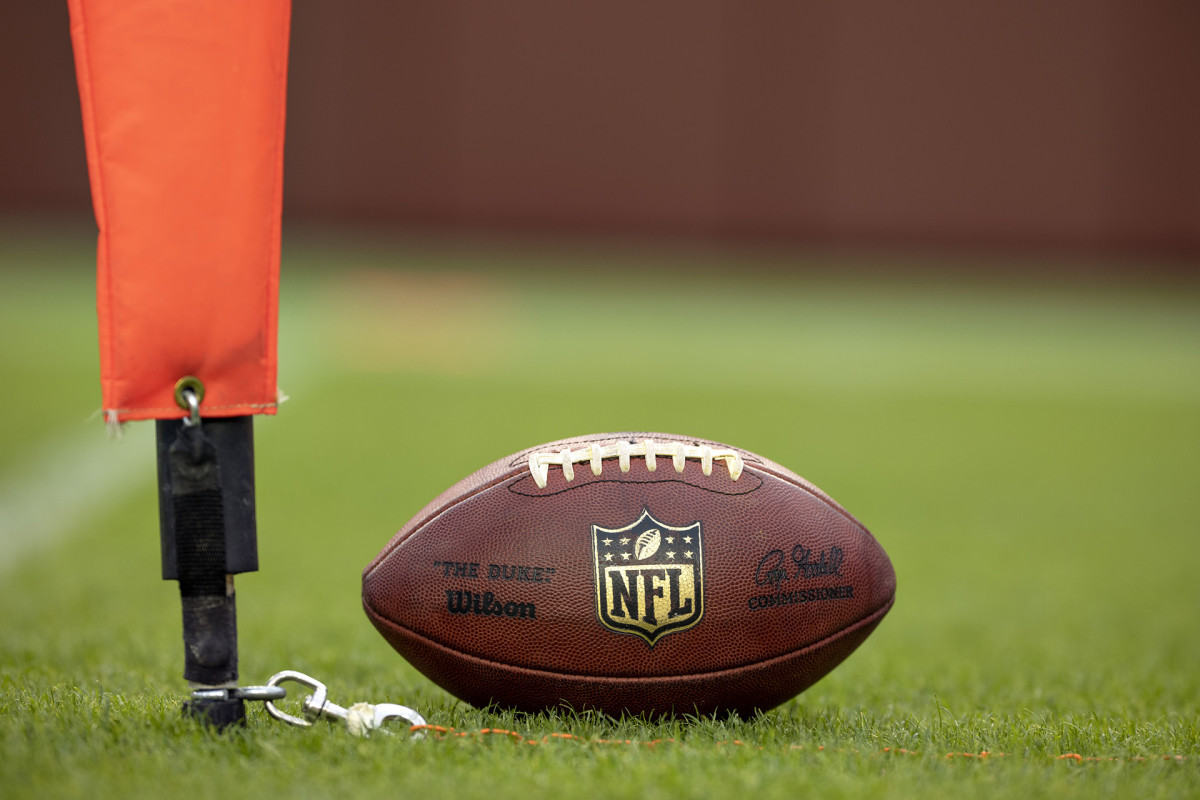NFL down marker being used for a measurement